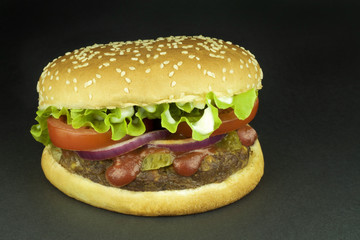 Hamburger on black background.