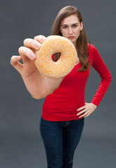 unhappy beautiful woman blaming symbol of unhealthy junk food