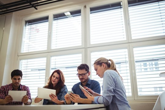 Business People Using Electronic Devices