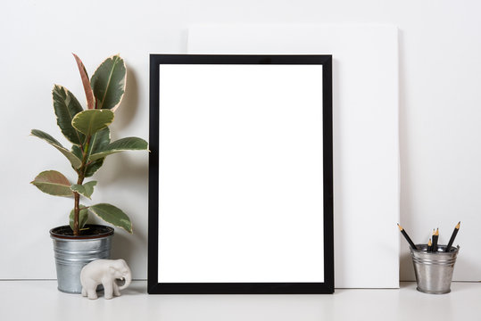 Styled tabletop, empty frame, painting art poster interior mock-
