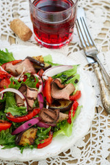 Warm salad of roast beef and vegetables - roasted bell peppers, eggplant, fresh tomatoes, red onion and lettuce with balsamic dressing
