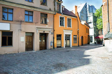 Fototapeta na wymiar Empty streets of the old town of Riga pavers early summer morning