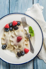 Closeup of homemade dumplings with berry fruits