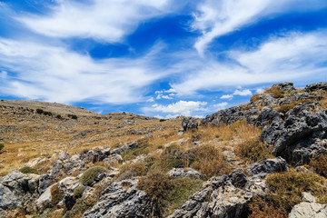 Fototapeta na wymiar mountainous landscape of volcanic rocks on the background of clouds