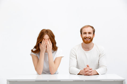 Tenderless Funny Redhead Girl And Boy Sitting At White Desk