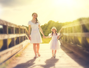 Mother and daughter walking .