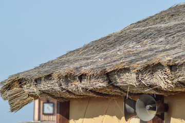The slope of the roof of reeds and straw