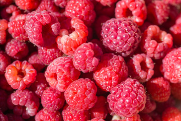 Fresh raspberries on beautiful background closeup photo