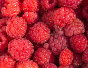 Fresh raspberries on beautiful background closeup photo