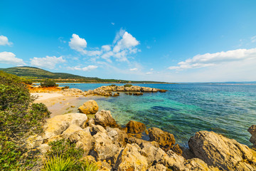 rocks and sand in Alghero shore