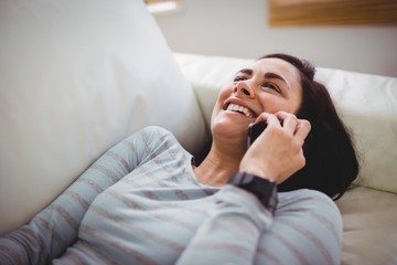 Smiling woman talking on phone