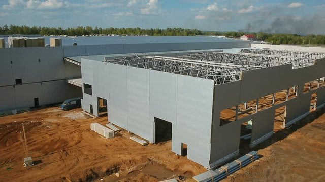 Construction of industrial buildings from metal constructions, aerial shot