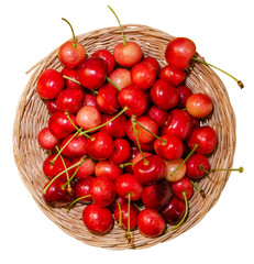 ripe cherries in a wicker dish plate