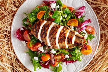 Grilled Chicken Breast fillet with fresh tomatoes vegetables salad. concept healthy food.