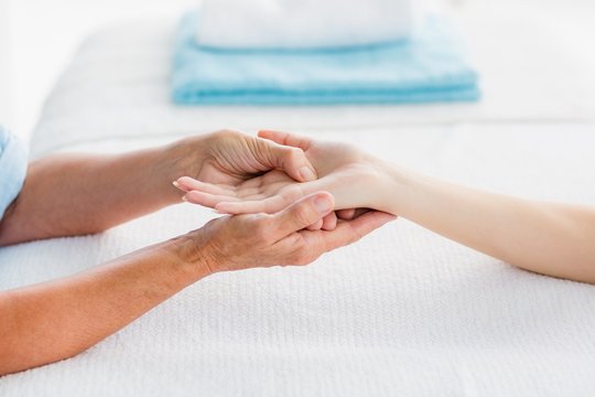 Cropped image of woman receiving hand massage