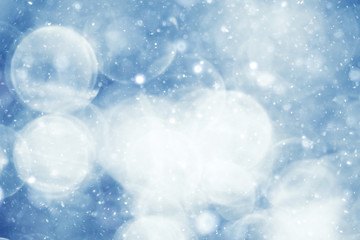 Fototapeta na wymiar silvery blue highlights snow rain water blurred background