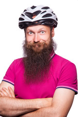funny happy european bearded cyclist wearing helmet with pink / purple t shirt. advise people to protection. studio shot. isolated on white.