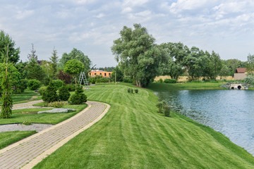 Landscaping with lawn and pond