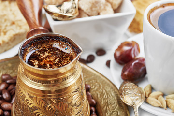 Traditional Turkish black coffee and sweet dainties