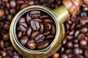 Coffee beans in a turkish coffee pot