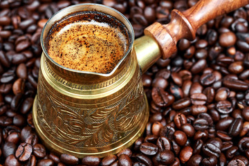 Hot black coffee in a traditional coffee pot