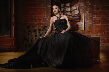 Sensual gothic woman in a long gorgeous black dress