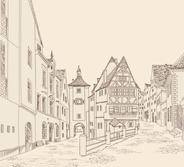 Street with buildings and cafe in old city. Cityscape - houses, buildings on alleyway. Old city view. Medieval european castle landscape
