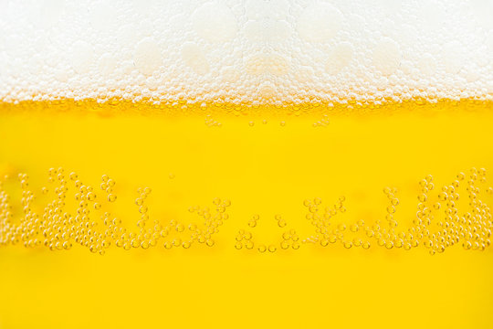 Background  texture of frosty beer with foam and bubbles
