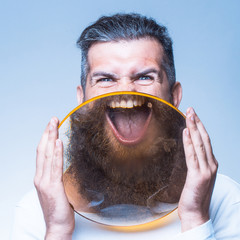 bearded man with magnifying glass