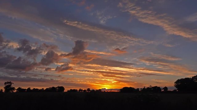 sunset to twilight with oak trees time-lapse: Rural English Landscape, Midlands: June 21st 2016