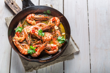 Fried king prawns served on hot pan
