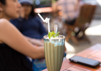 Caramel frappe coffee and mint leaf