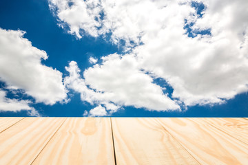 Wood table top on sky background