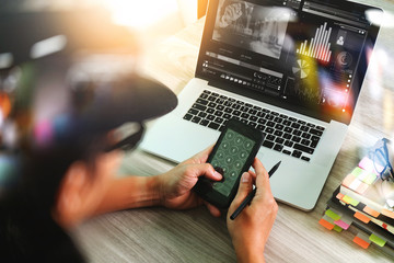 Fototapeta premium designer hand attending video conference with laptop computer an