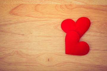Valentine day background, red love heart on wooden background