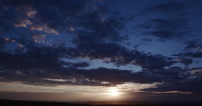 4K Time-lapse of sunset with moving clouds 