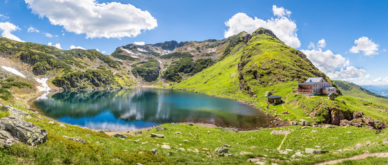 Beautiful mountain panorama with lake and mountain hut in Tyrol, - obrazy, fototapety, plakaty