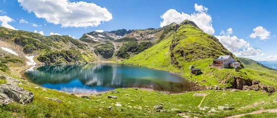 Gordijnen Beautiful mountain panorama with lake and mountain hut in Tyrol, © mRGB