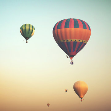 Hot air balloon on sun sky with cloud, vintage and retro instagram filter effect style