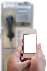 Hand holding smartphone with blurry background of he old public