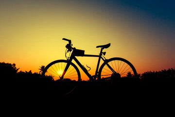 Fototapeta na wymiar Silhouette bicycles on sunset sky