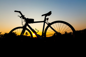Fototapeta na wymiar Silhouette bicycles on sunset sky