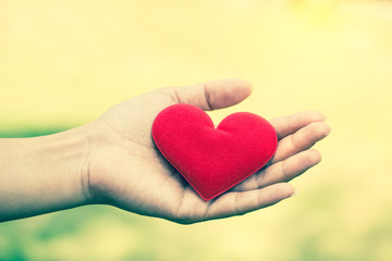 Hand hold love valentine heart. vintage filter