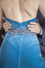 Midsection Of Dancer Touching Woman's Waist While Performing Tan