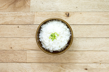 Cooked rice on wood table at top view