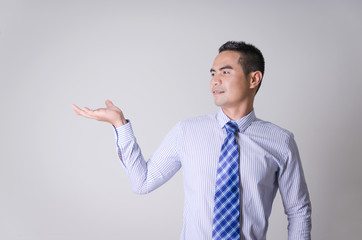 Portrait of asian Thai business man showing blank hand like hold