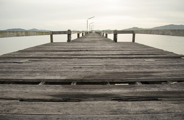 Fototapeta premium The wood bridge on the time in beautiful day, Ranong Thailand 