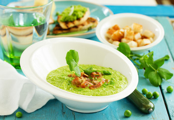 Soup of green peas with bacon and mint.