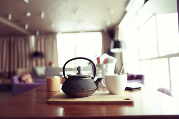 teapot and cup of tea at a cafe