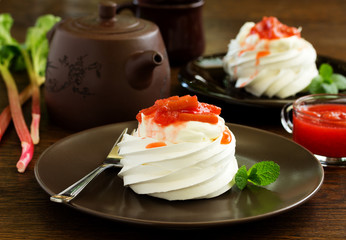 Dessert of meringue with rhubarb and mint sauce.